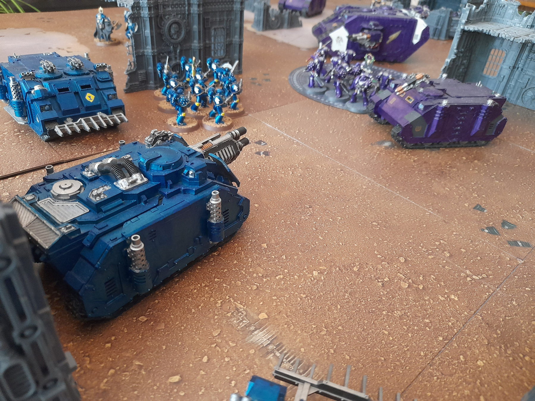 A battle between Ultramarines and Emperor's Children from Warhammer: the Horus Heresy