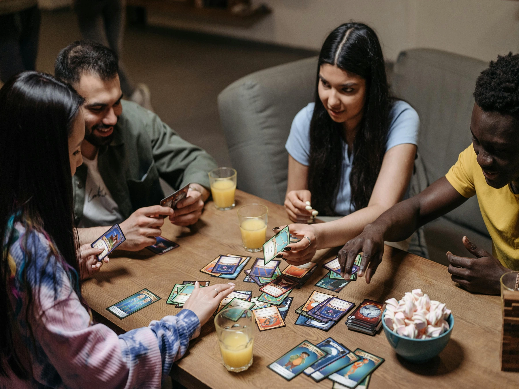 a group of people playing a card game